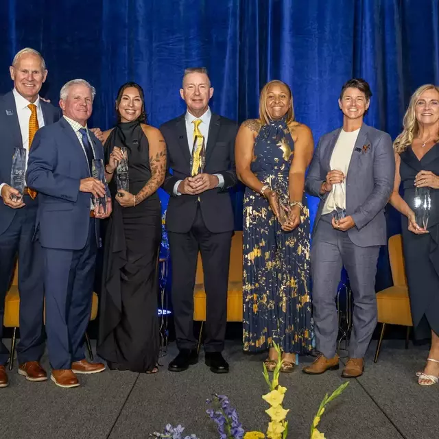 From left: With Donald R. Shepherd Director of Athletics Warde Manuel -- John Beilein, Joe McFarland, Sierra Romero, Chris Sabo, Nikki Peters, Shana Welch, Bev Plocki and Kellen Russell