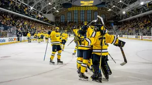 Michigan ice hockey postgame win celebration on ice