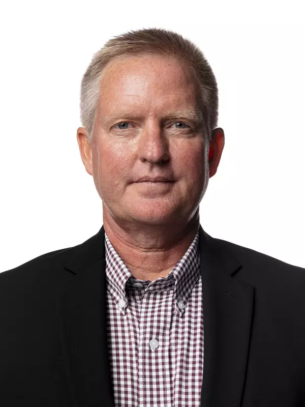 STARKVILLE, MS - October 05, 2021 - Mississippi State Interim Head Coach Doug Novak headshot taken during Women’s Basketball Production Day at Humphrey Coliseum at Mississippi State University in Starkville, MS. Photo By Chamberlain Smith