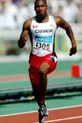 Canadian sprinter Pierre Brown of Toronto, Ontario, runs during the 100m heat during the Athens 2004 Summer Olympic Games Saturday, August 21, 2004. Brown crossed the line with a time of 10.32 to move on. (CP PHOTO/COC-Andre Forget) Le sprinter canadien Pierre Browne de Toronto, Ontario, court lors de la ronde de qualification au 100 m aux Jeux olympiques d'été à Athènes le samedi 21 août 2004. Browne a franchi la ligne d'arrivée avec un chrono de 10.32 qui lui permet d'avancer.