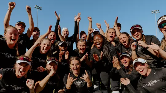Mizzou Softball cheering after taking a photo during the scrimmage against Kansas during Fall Ball