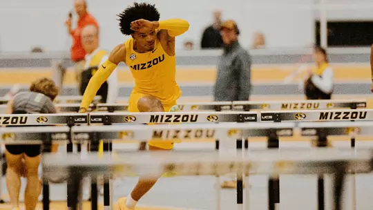 Dillon Leacock competes in the 60m hurdles.