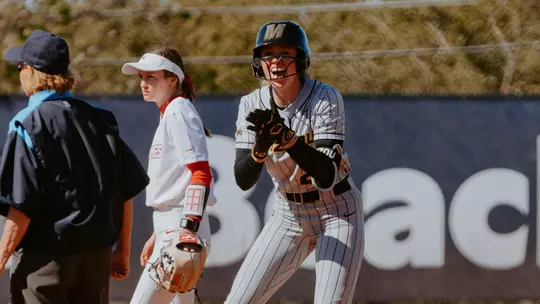 Haidyn Sokoloski celebrates as she hits a double against Liberty on Feb. 7