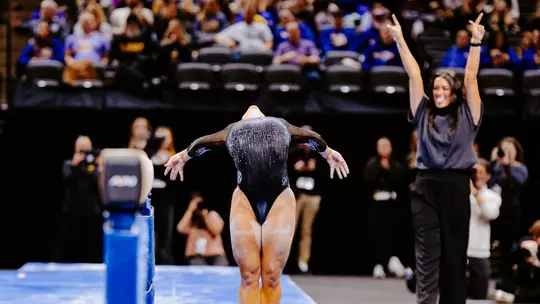 Amy Wier celebrates following her beam routine during the team's meet against LSU on Jan. 30, 2026.