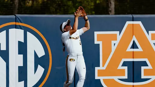 Danielle Blackstun catches the ball in the outfield against Auburn