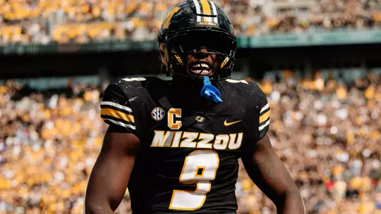 Missouri come from behind to defeat Kansas, 42-31, at Memorial Stadium.
