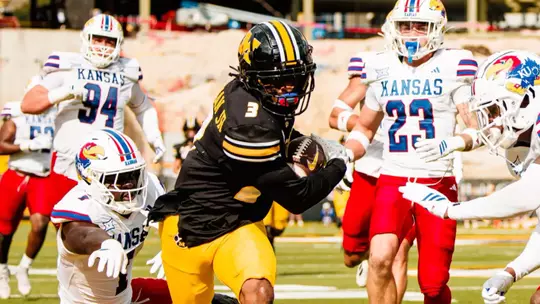 Missouri come from behind to defeat Kansas, 42-31, at Memorial Stadium.
