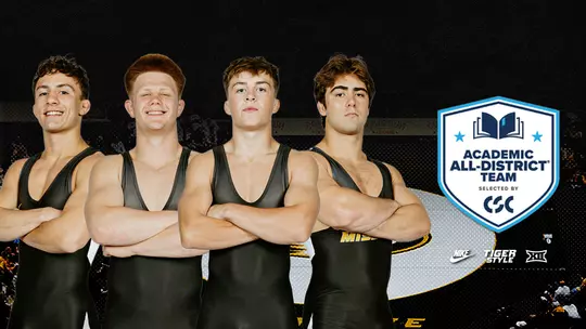 Graphic featuring Easton Hilton, Aeoden Sinclair, Mack Mauger and Jarrett Stoner, Missouri wrestlers, standing shoulder-to-shoulder with their arms crossed, wearing black Mizzou singlets. The wrestlers are posed in front of a dark arena background with a stylized Tiger logo behind them. On the right side of the graphic is the Academic All-District Team badge, indicating recognition by College Sports Communicators (CSC). Mizzou Wrestling, Nike, Tiger Style, and Big 12 logos appear in the lower-right corner. The graphic celebrates four Missouri wrestlers earning Academic All-District honors.