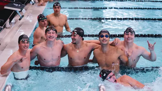 Mens swim celebrates win over SDSU