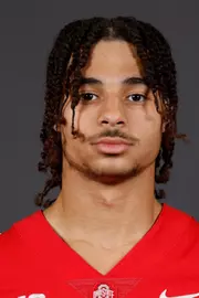 A headshot of Grayes
