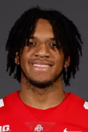 A headshot of Kai Saunders