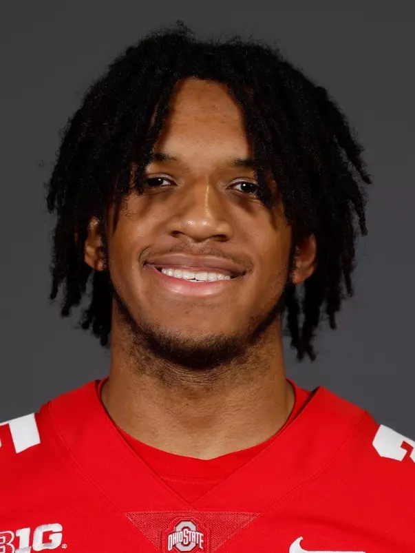A headshot of Kai Saunders