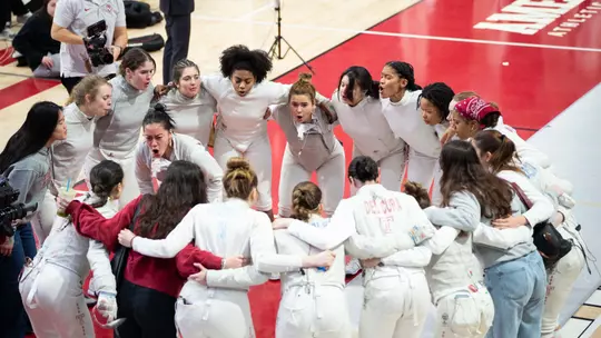 Fencing team huddle