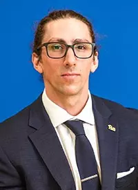 A headshot of Anthony Bricker