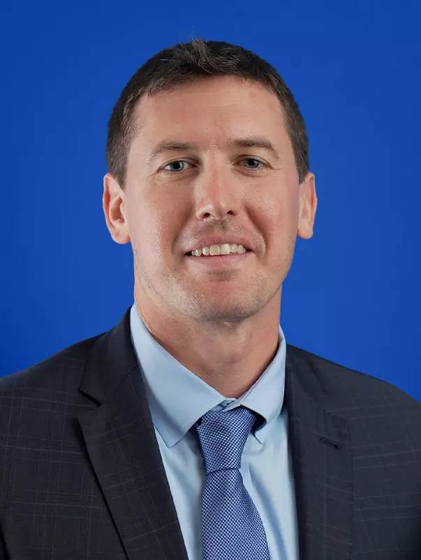 Headshot of Roman Willets in Business Attire