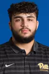 Headshot of Mustafa Woodi