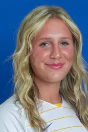 Headshot of Bella Haynes in white uniform
