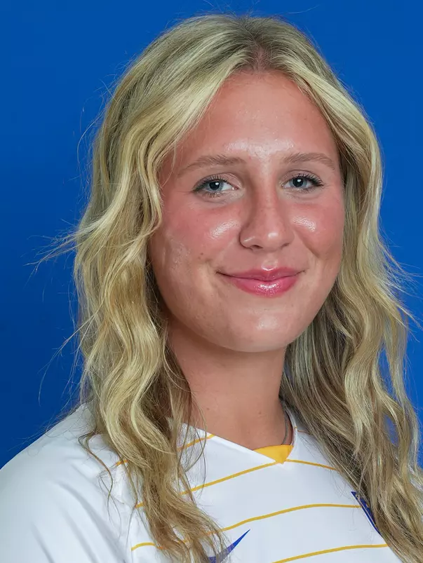 Headshot of Bella Haynes in white uniform