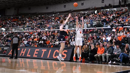 CJ Happy shoots in crowded Jadwin Gym