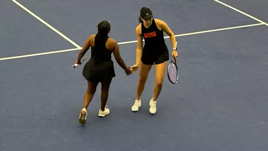 Tsehay Driscoll and Pearlie Zhang clap hands