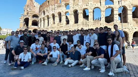 Men's Lacrosse Team In Front of Colosseum In Rome