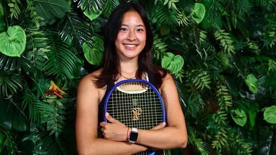 Pearlie Zhang in front of jungle set
