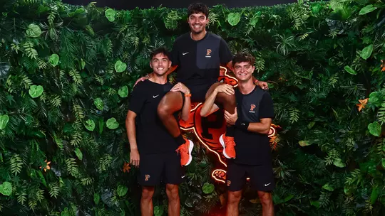 Landon Ardila carried by Evan Wen and Aleksandar Mitric