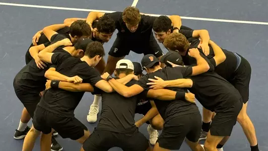 Men's Tennis Team huddle
