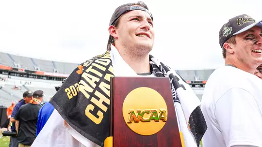 Andrew McMeekin with NCAA Championship Trophy