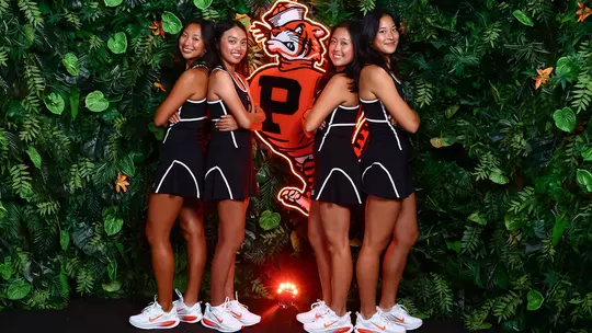 Four women's tennis players jungle set