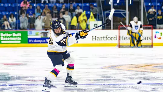 Makayla Watson shooting the puck against Northeastern (Oct. 16, 2026 in Hamden, CT)