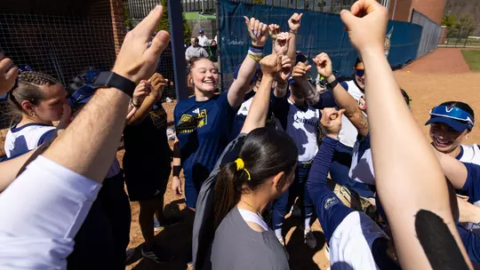 Softball Group Huddle Before Playing Manhattan (April 4, 2026)