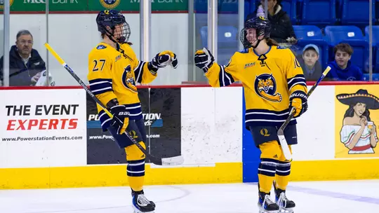 Ella Johnson and Avery Bairos Celebrate a Goal Against Brown (Feb. 27, 2026 in Hamden, Conn.)