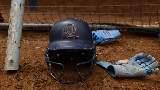 Softball Gear Lying on Dirt