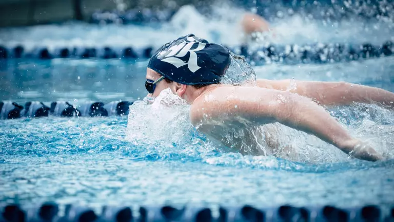 Archibald Wins 100 Fly; Owls Move Into Third at NIC