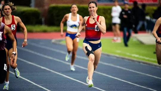 Caroline Donohoe with a determined face about to cross the finish line