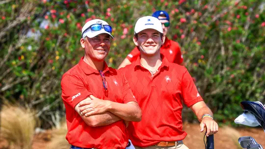 Adam Decker and Lucas Rizo-Patron smile on the tee box