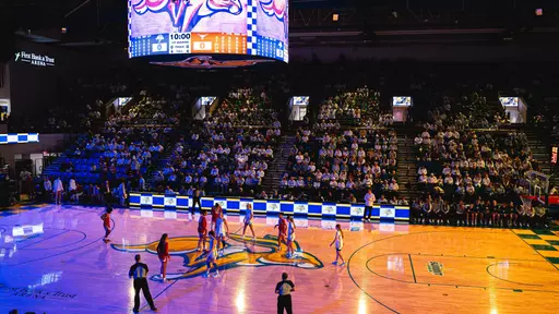 A women's basketball team gets ready for tip off.