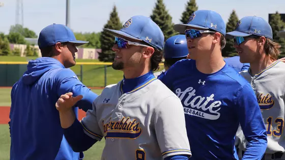 South Dakota State baseball players and coaches go through the handshake line after a 7-3 Jackrabbit victory over Oral Roberts on May 20, 2026, at the Summit League Baseball Championship in Minneapolis, Minnesota.