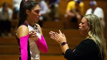Head Coach Brittany Harry talks to Ella McFarland.