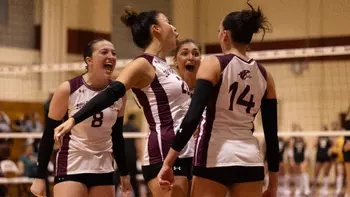 The team celebrates after a point.