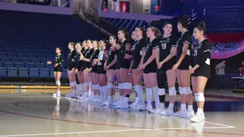 The team looks on during opposing introductions.