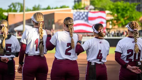 Southern Illinois lines up for the national anthem during its 10-1 (5) run-rule win over SIUE on Wednesday, April 29, at Charlotte West Stadium.