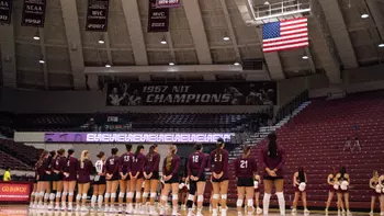 The team stands side-by-side during the National Anthem.