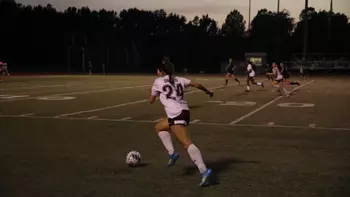 Celina Pinelli runs toward the ball during a night soccer match against Lindenwood