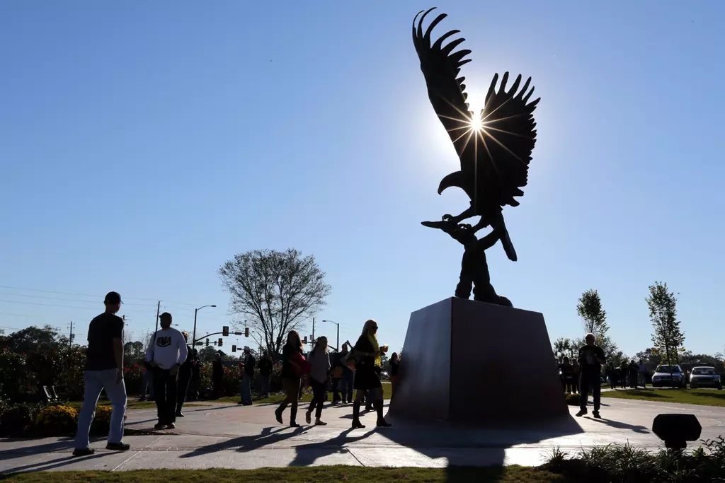 Football fans gather around Lofty Return, a statue dedicated this week on campus. Mandatory Credit: Chuck Cook-USA TODAY Sports