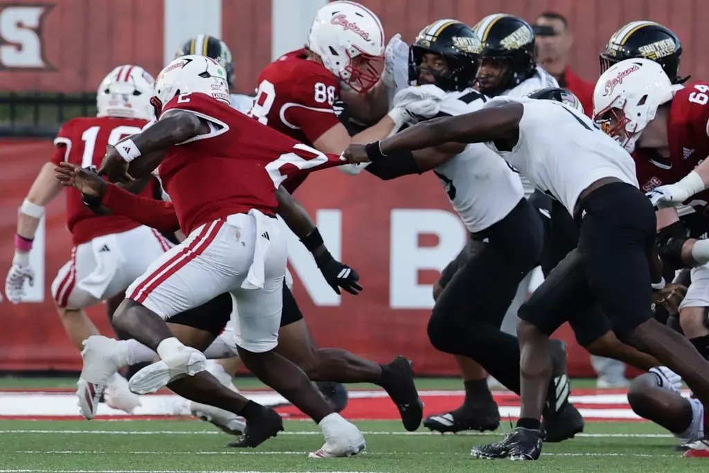 Southern Miss defense brings down Louisiana-Lafayette Ragin Cajuns quarterback Lunch Winfield (2) In a game between Southern Miss and Louisiana and in the NCAA Football game. October 18, 2025 (Joe Harper/bgnphoto.com)
