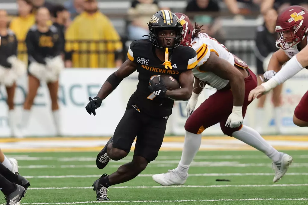 Southern Mississippi Golden Eagles wide receiver Elijah Metcalf (9) runs through a big hole)in a game between Southern Miss Golden Eagles and ULM Warhawks and in the NCAA Football game. October 25, 2025 (Joe Harper/bgnphoto.com)