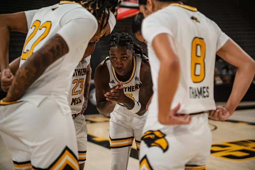 Jakayla Johnson leads a huddle against Northern Illinois