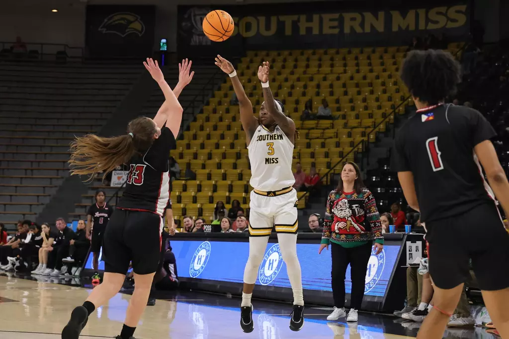 Southern Mississippi Golden Eagles guard Jakayla Johnson (3) shoots a three point shot in a game between Southern Miss Golden Eagles and Louisiana in a NCAA Women's Basketball game. December 20, 2025 (Joe Harper/bgnphoto.com)